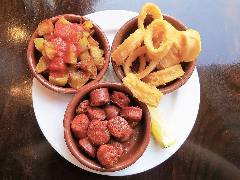 Chorizo sausage calamari and potatoes tasty tapas TravelAndHome