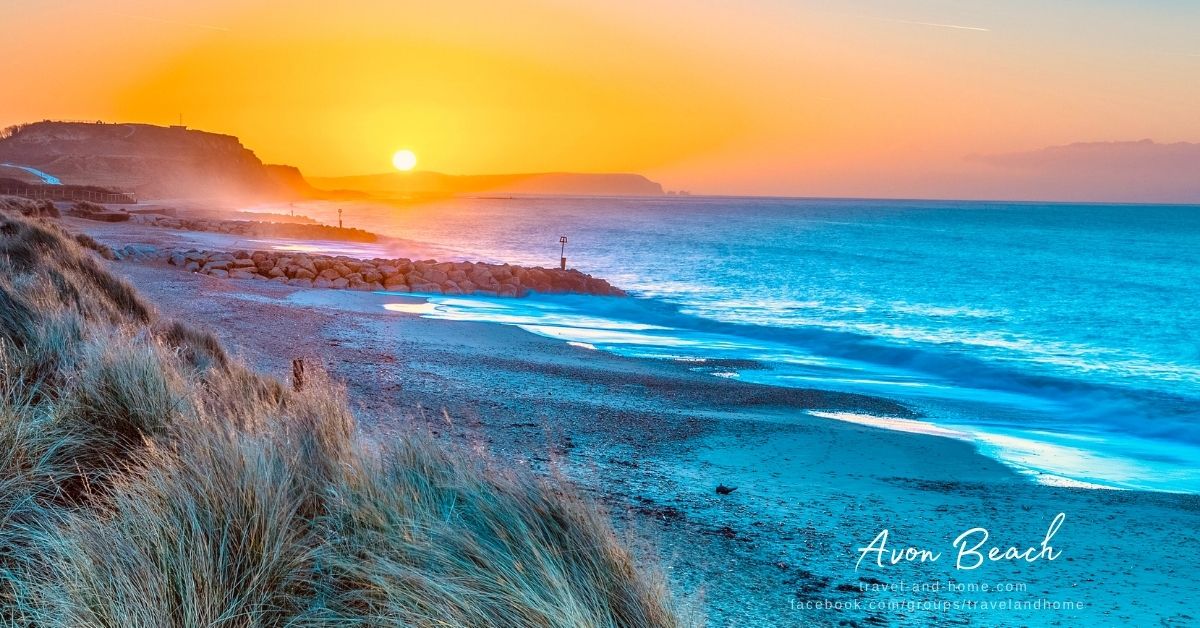 Dorset UK United Kingdom Avon beach in Christchurch sunset sea mountain ocean