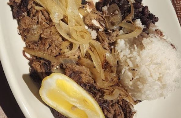 vaca frita crispy fried beef served with onions and lime cuban cuisine traditional cuban dishes you must try in Miami city travel and home